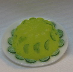 HO49 - Lime gelatine mold with fruit - Click Image to Close